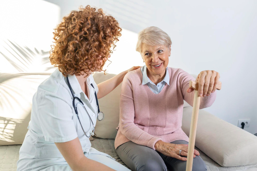Healthcare worker and elderly woman